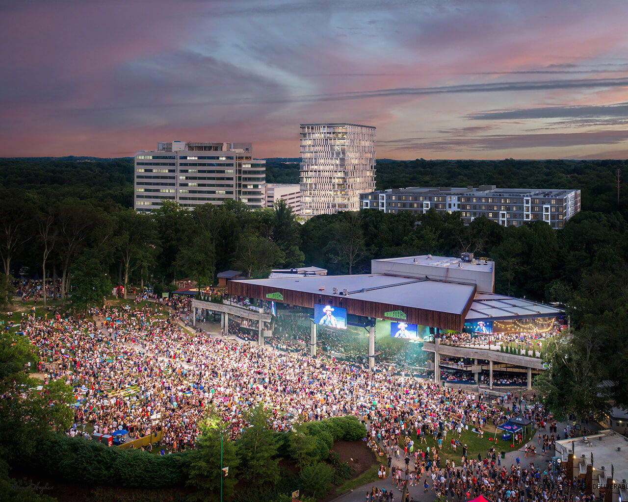 Outdoor event with 6300 Merriweather in the background.